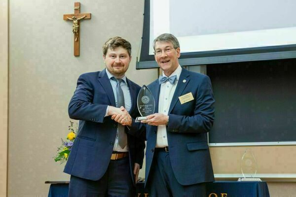 Dr. Dowling receiving James A Burns award